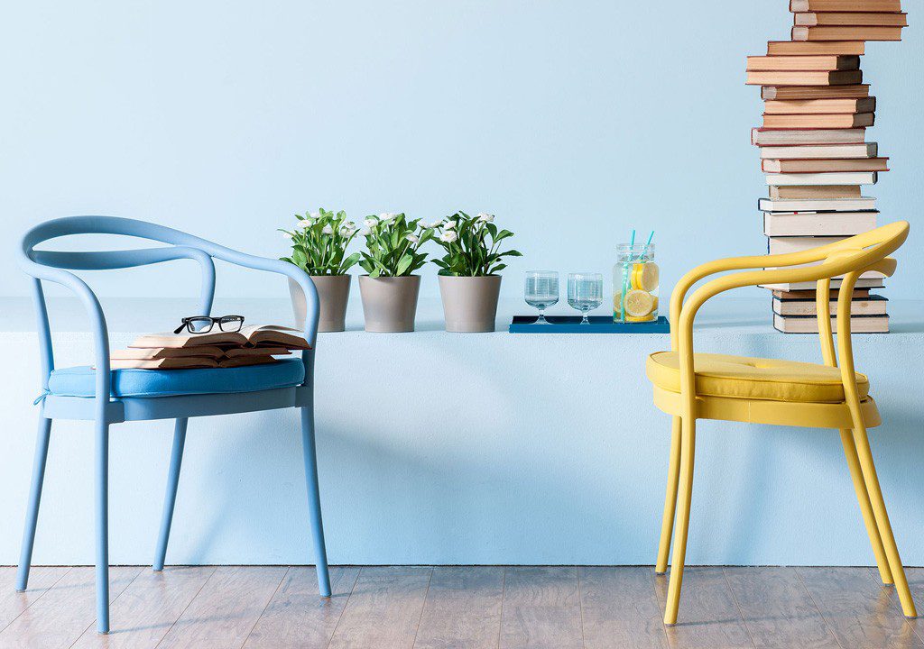 Blue and yellow chairs in a room.