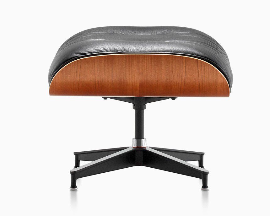 Black leather ottoman with wood base.