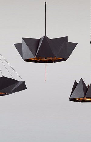 Black origami pendant lamps with light.