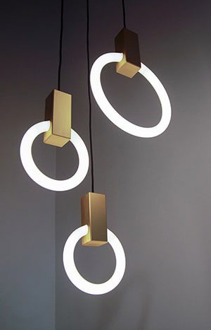 Three gold ring pendant lights.