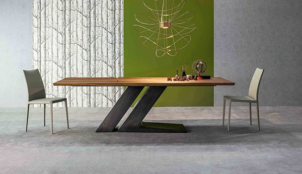 Modern dining room with wooden table and chairs.