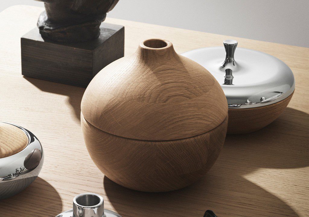 Wooden round box with lid and silver trim.