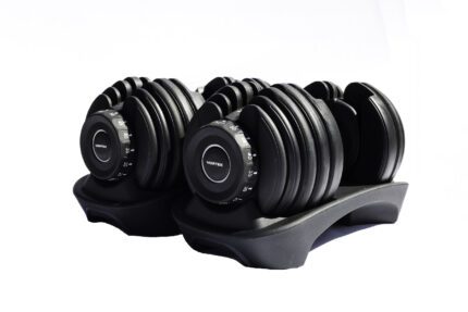 Adjustable Vortex dumbbells on stand.