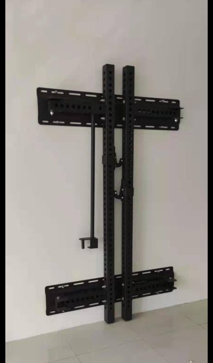 Black metal wall mounted gym rack.