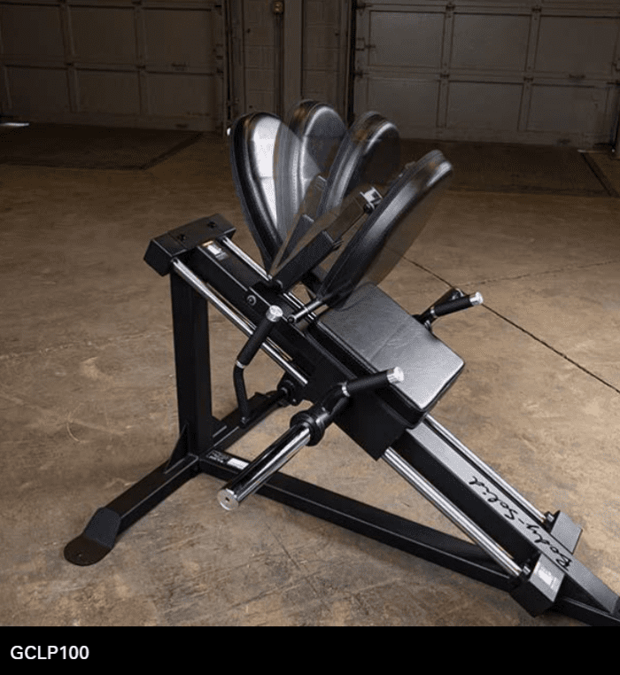 Black leg press machine in a gym.