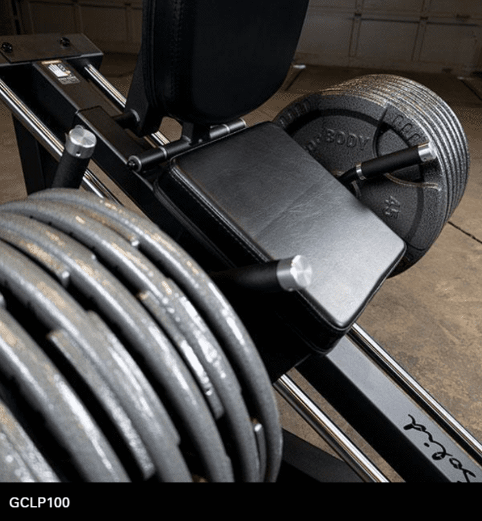 Leg press machine with weight plates.