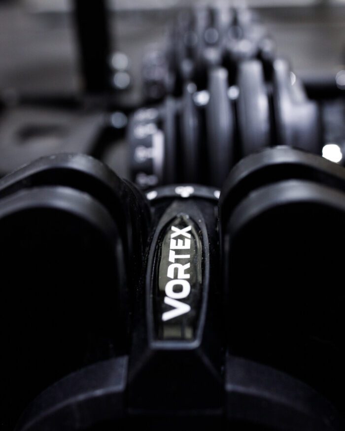 Closeup of a Vortex adjustable dumbbell.