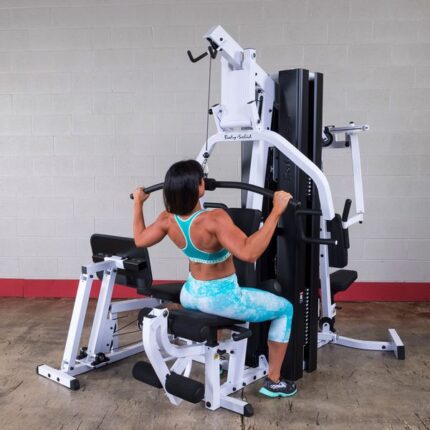 Woman using a home gym machine.