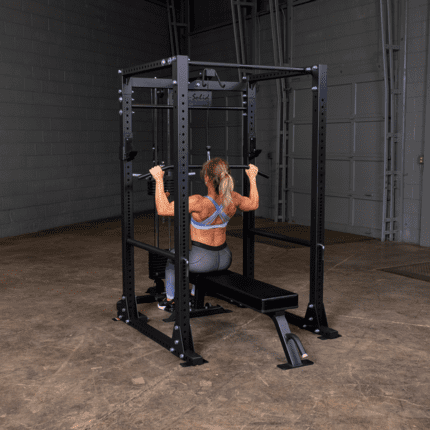 Woman doing lat pulldown exercise on a machine.