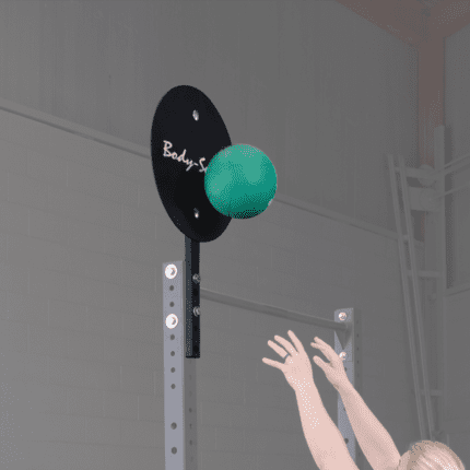 Person catching a green ball on a rack.