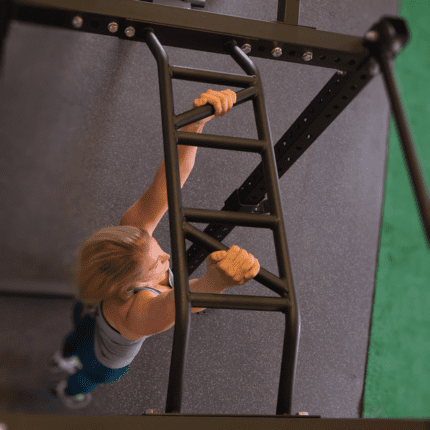 Woman climbing a black ladder.