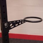 Black metal weight plate storage rack.