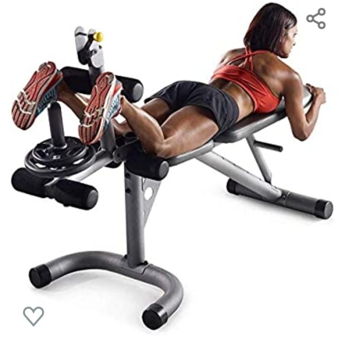 Woman exercising on a weight bench.