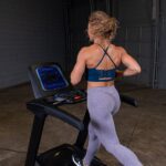 Woman running on an indoor treadmill.