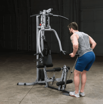 Man working out on a home gym machine.