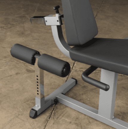 Leg extension machine with padded seat.