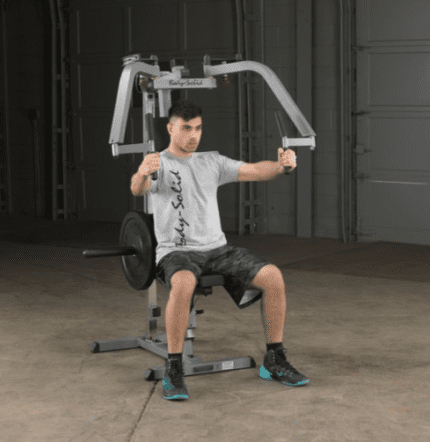 Man using a Body-Solid chest press machine.