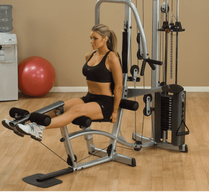 Woman working out on a leg press machine.