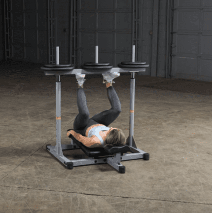 Woman using a leg press machine.