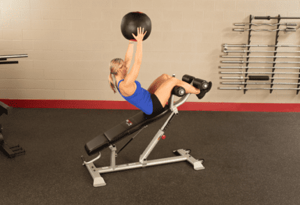 Woman exercising with a medicine ball.