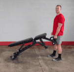 Man using a weight bench for exercise.