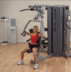 Woman working out on a Body-Solid home gym.