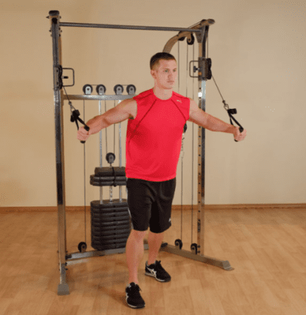 Man doing chest fly on a cable machine.