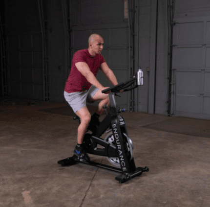 Man exercising on a stationary bike.