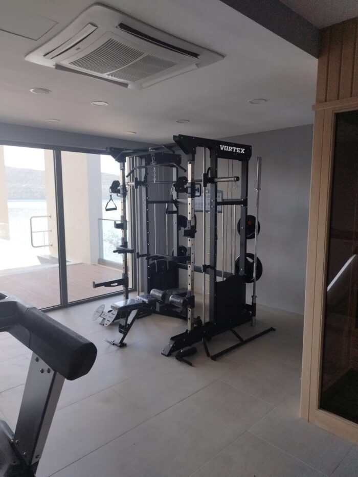 Black gym equipment in a room.