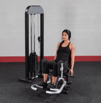 Woman exercising on a leg press machine.