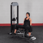 Woman using a leg press machine.