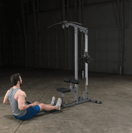 Man using lat pulldown machine for exercise.