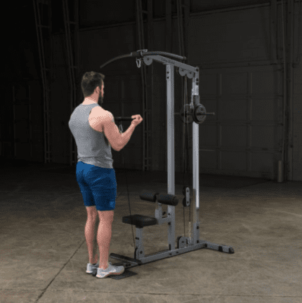 Man using a lat pulldown machine.