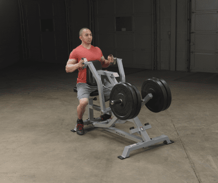 Man working out on a chest press machine.