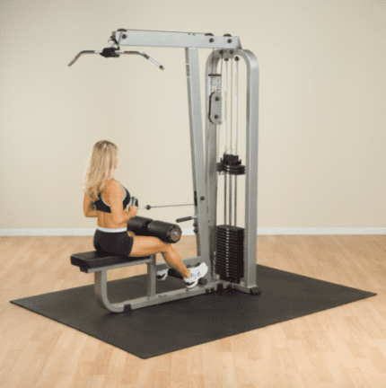 Woman exercising on a lat pulldown machine.