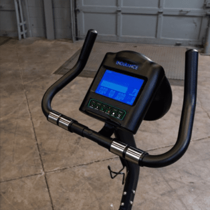 Black stationary bike with digital display.