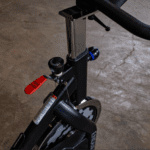 Black stationary bike with red lever