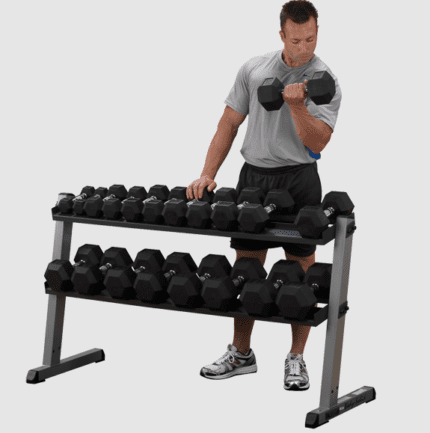 Man lifting dumbbells on a rack.