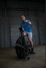 Man exercising on a fan bike.