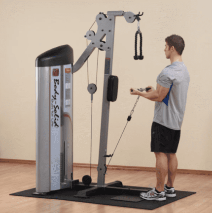 Man exercising on a Body-Solid cable machine.