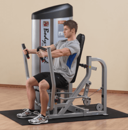 Man using chest press machine.