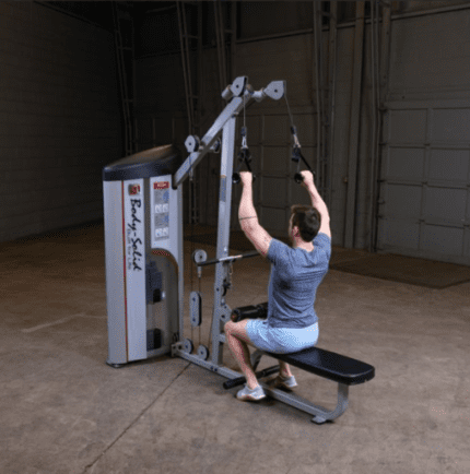 Man using lat pulldown machine.