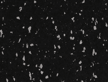 Black and white speckled surface.