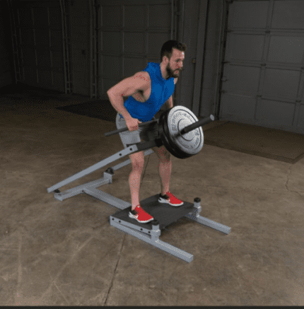 Man using a reverse hyperextension machine.