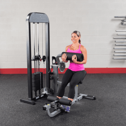 Woman working out on a leg press machine.