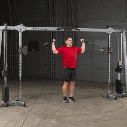 Man working out on a cable machine.