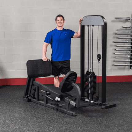 Man using leg press machine at gym.