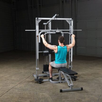 Man exercising on a lat pulldown machine.