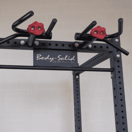 Black power rack with red grips.