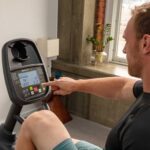 Man using SportsArt C95 recumbent bike.